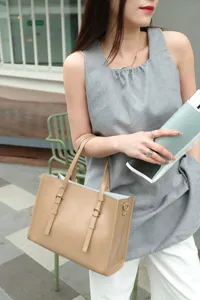 Genuine leather retro tote bag detail, casual commuter handbag with double straps and metal buckles.