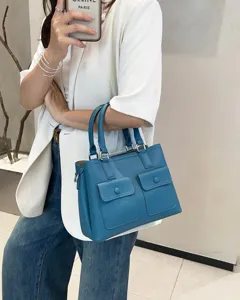 Blue leather handbag detail, top layer cowhide tote bag, daily casual commuter crossbody.