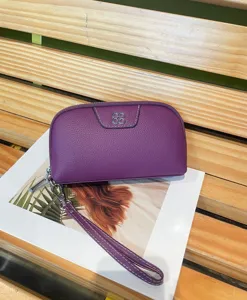Purple genuine cowhide leather clutch wallet for women with wrist strap and metal clover detail.