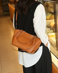 Genuine leather tote bag for women, stylish brown shoulder bag with large capacity.