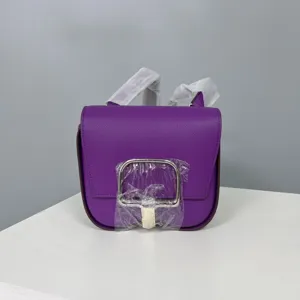 Purple leather saddle bag for women, elegante crossbody shoulder bag with metal stirrup buckle.