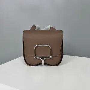 Brown leather shoulder bag with metal clasp, premium grain texture, chic crossbody mini style.