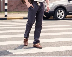 Comfortable men's casual trousers with drawstring waist in dark grey. Perfect daily wear.