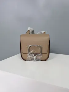 Stylish leather saddle bag for women, classic shoulder cross body bag with metal lock.