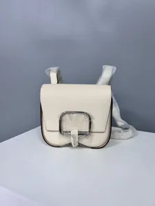 White leather saddle bag for women, stylish minimalist crossbody shoulder bag with metal buckle.