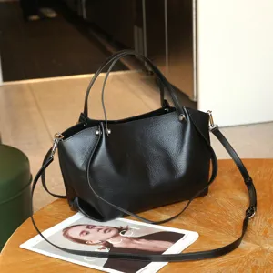 Black genuine leather tote bag, premium cowhide grain handbag with shoulder strap.