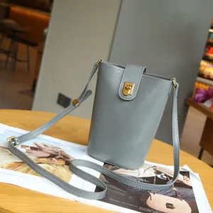 Premium leather phone crossbody bag for women, stylish small shoulder bag with lock.