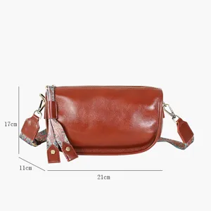 Leather pillow crossbody bag detail showing dimensions and ethnic strap design for women