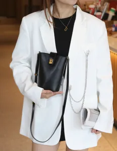 Genuine leather bucket bag for women, stylish crossbody phone bag with metal lock closure.