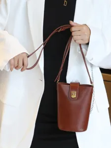 Stylish brown genuine leather bucket bag, minimalist womens crossbody bag for daily use.