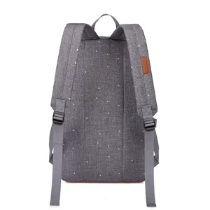 Grey polka dot canvas backpack for school and casual daily use, back view showing straps.