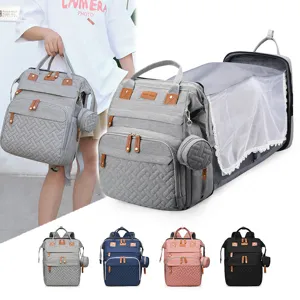 Multi-functional diaper bag backpack with foldable baby bed and mosquito net, large capacity travel bag.