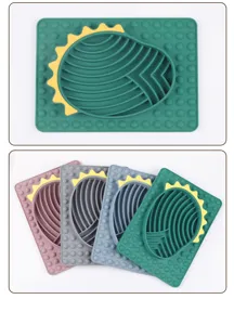 Silicone pet slow feeder mat with dinosaur shape and bubble design, ideal for cats and dogs.