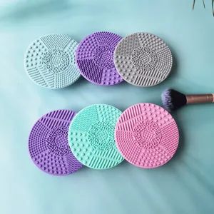 Detailed view of silicone makeup brush cleaning pads with textured multi-color design.