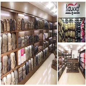 Detailed view of canvas backpacks displayed neatly on warehouse showroom wooden shelves.