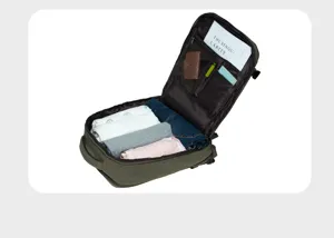 Detail view of the large capacity canvas backpack interior compartments and clothing storage.