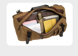 Interior detail of vintage canvas travel backpack showing multiple compartments and storage.