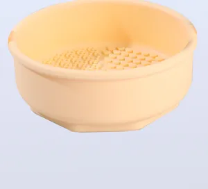 Silicone makeup brush cleaner bowl with textured heart bumps for efficient cleaning tools detail view.