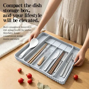 Extendable silicone cutlery organizer tray for kitchen drawers, multi-compartment storage box.