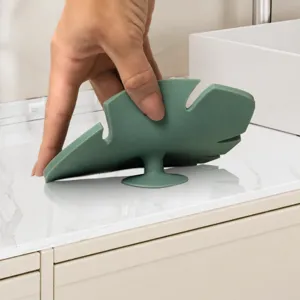 Silicone makeup brush cleaning mat featuring leaf shape and bottom suction cups.