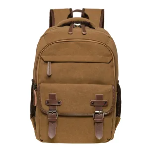 Vintage brown canvas backpack with leather straps for school, travel, and daily use