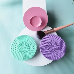 Silicone makeup brush cleaning pad set with round scrub mat and brush holder for deep cleaning.