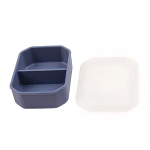 Portable silicone lunch box with 2 compartments and lid, perfect for school and office use.