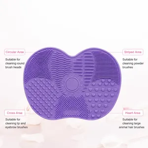 Silicone makeup brush cleaning pad with various textured areas for deep cosmetic brush washing.