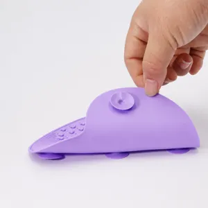Silicone makeup brush cleaning mat with suction cups, purple apple design for beauty tools.