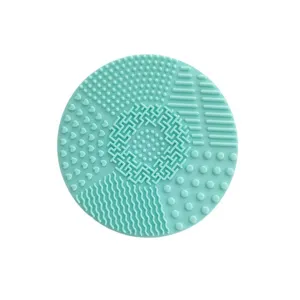 Silicone makeup brush cleaning mat, round washing pad with multi-texture surfaces for tools.