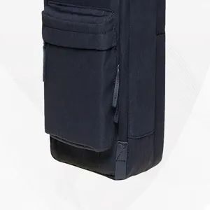 Detailed view of dark blue backpack front pocket and zipper, showing fabric texture and design.