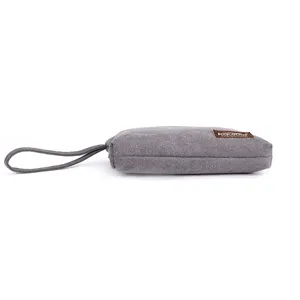 Grey canvas coin purse wristlet bag side view, minimalist casual daily phone pouch.