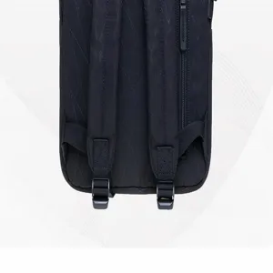 Detailed close-up view of black solid color casual backpack back straps and zipper.