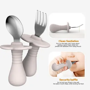 Baby silicone training fork and spoon set with stainless steel head and anti-choking baffle.
