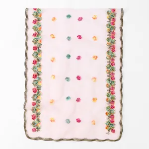 Close-up detail of the pink mesh scarf featuring colorful floral embroidery and lace trim.