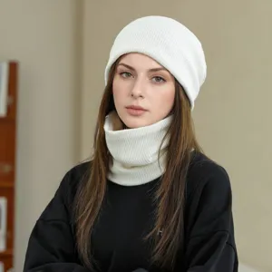 Women winter white knit beanie and neck warmer set detail showing cozy warm fabric texture.