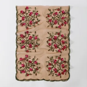 Embroidered mesh scarf floral shawl close-up view showing delicate pink flowers and green vines.