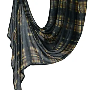 Plaid shawl detail view showing soft draped fabric texture and elegant digital print pattern.