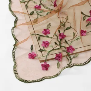 Spring summer embroidery scarf detail, sheer nylon fabric with pink floral vine embroidery.