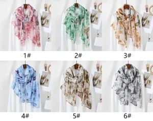 Close-up detail of stylish floral print long scarf, soft breathable fabric with butterfly patterns.