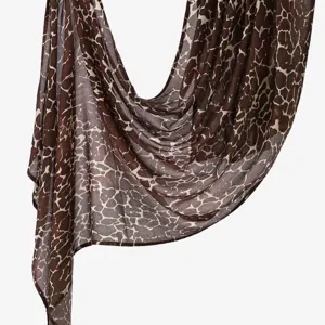 Detailed view of women's digital printed cotton-linen long scarf shawl with abstract pattern.