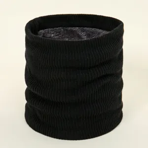 Detailed view of a black knitted winter neck warmer with thick fleece lining for warmth.