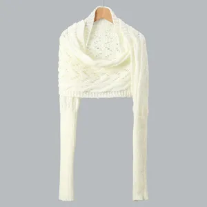 White knitted hollow-out sleeve shawl detail, elegant arm warmer winter fashion accessory.