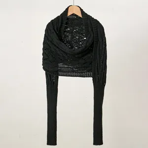 Details of the black hollow-out knitted shawl with long sleeves for women autumn winter.