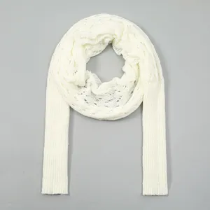 Detailed view of the white hollow-out knit sleeved shawl, perfect for autumn and winter.