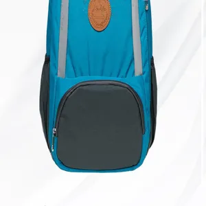 Close up detail view of blue casual backpack with reflective strips and front zipper pocket.