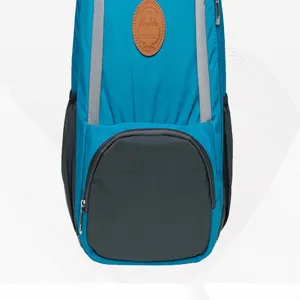 Detailed view of the blue casual backpack featuring a stylish brown leather patch and zipper.