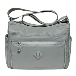 Casual gray crossbody shoulder bag for women with multi-pockets and adjustable strap.