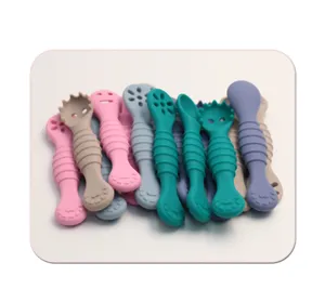 Silicone baby training spoon detail showing soft double-headed design for infant feeding.