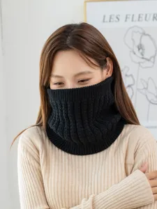 Detailed view of thick black knitted neck warmer, soft winter thermal cold weather accessory.
